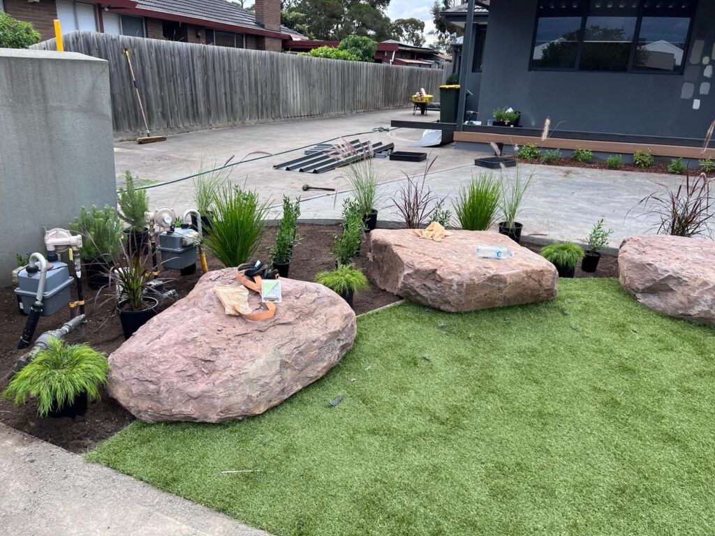 Wide view of a finished front yard with artificial turf