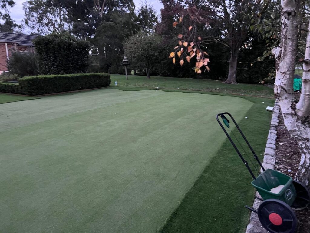 Artificial putting green and lawn in a back garden