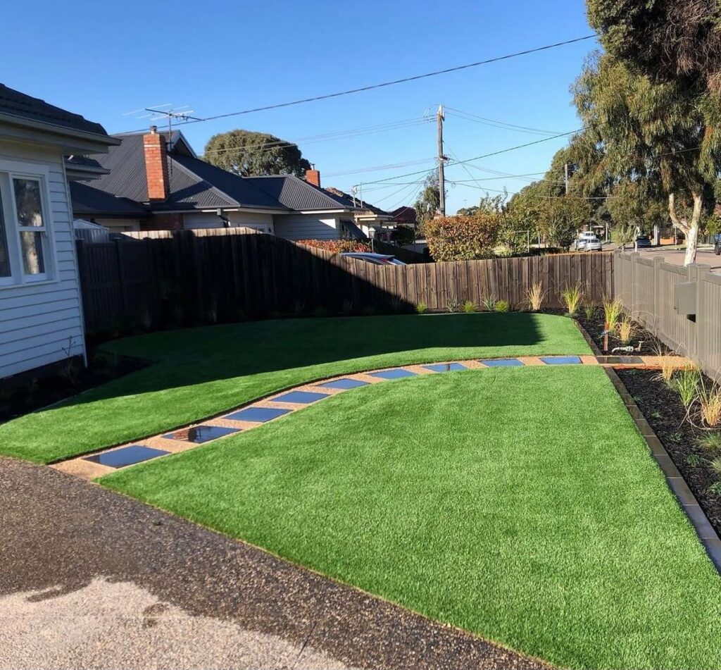 Backyard artificial turf with a stepping-stone path