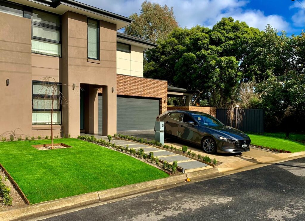 Artificial turf front yard on a new double-storey home